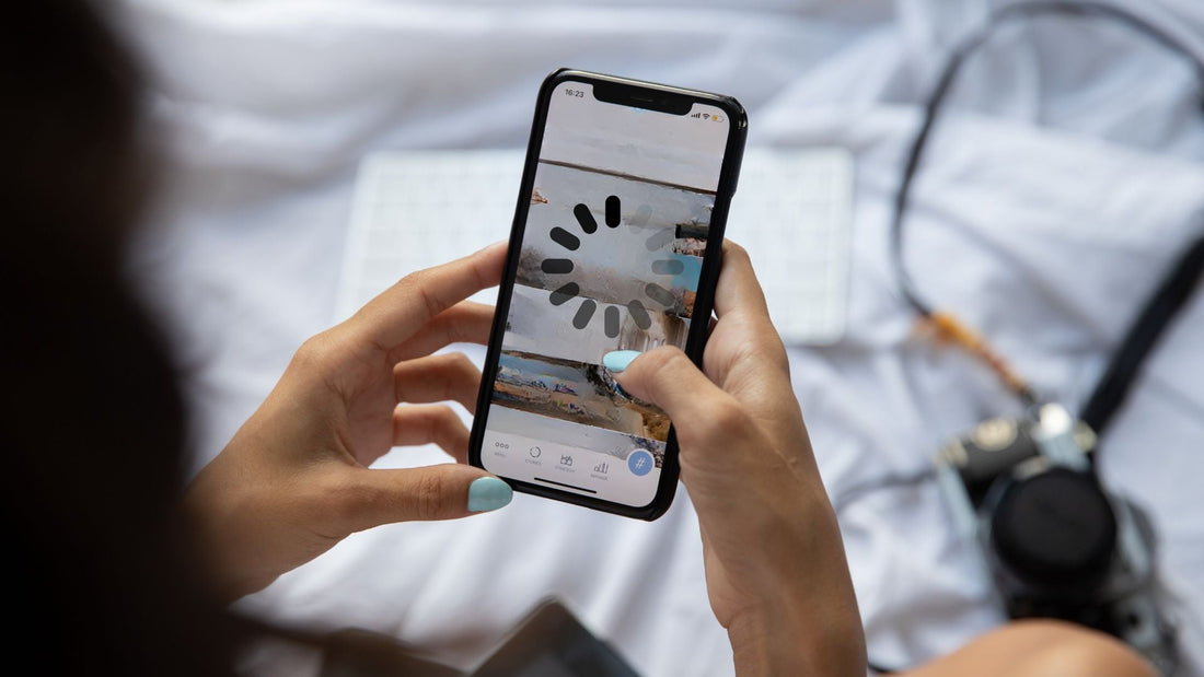 Close-up photo of woman holding an iPhone with lagging issues