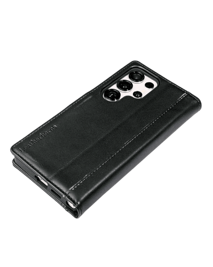 a black s25 ultra leather wallet case with phone inside laying on the table
