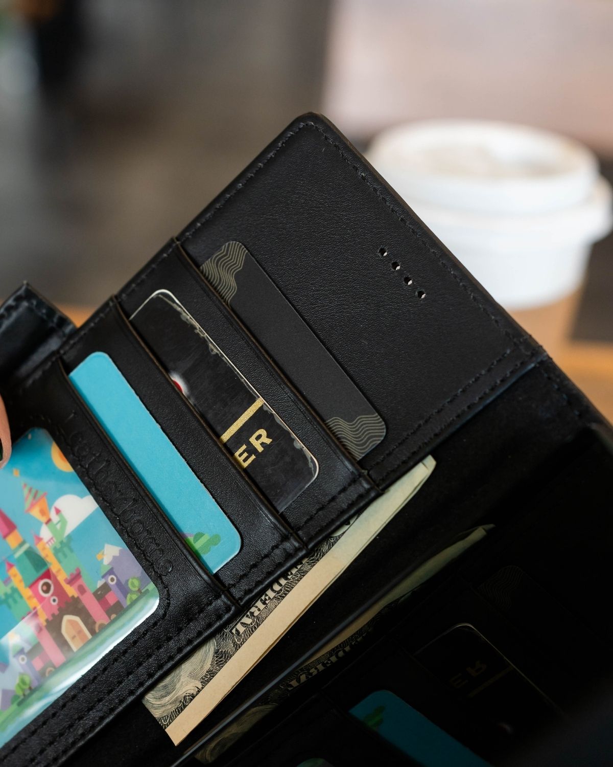 a close up shot of the earpiece of the leather case for samsung s25 ultra
